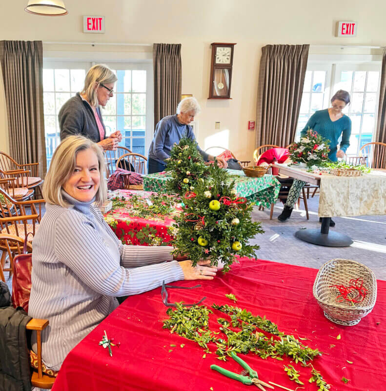 Photo by Lori York. 
Kerry Pughe participates in a boxwood table top tree workshop