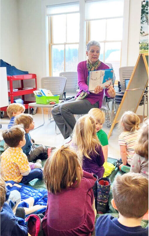 Courtesy photo
Cheryl Sloan, youth services librarian, shares pictures from a book she is reading to a group at Story Time.