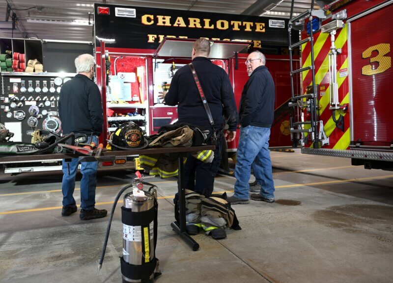 Photo by Lee Krohn. Duty crew C.J Webber explains Engine 2's firefighting capabilities.