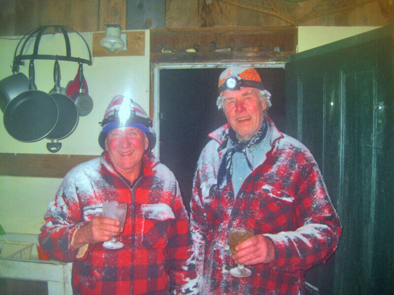 Courtesy photo.
Tuck Cantrell, left, and Hank Hagar have walked from a neighboring deer camp in the evening after the day’s hunting is done for some joy and laughter in the early 2000s. They would visit even in blizzards. These are the good old days for Bradley Carleton.