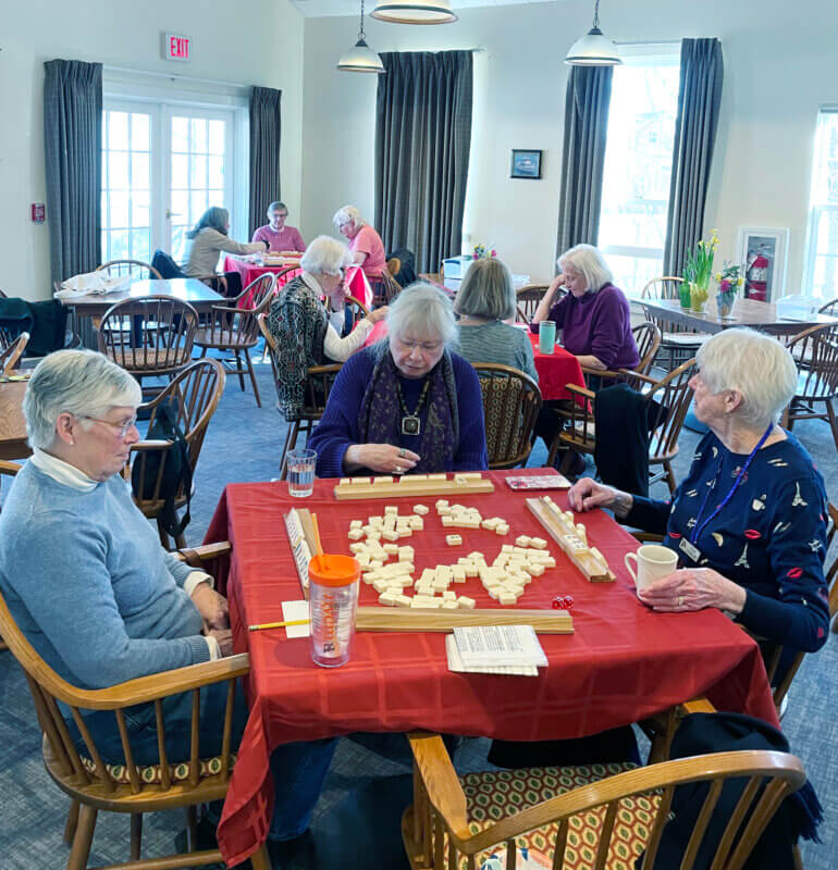 Photo by Lori York.
Seniors focus on the game of Shanghai Mahjong at the Charlotte Senior Center.