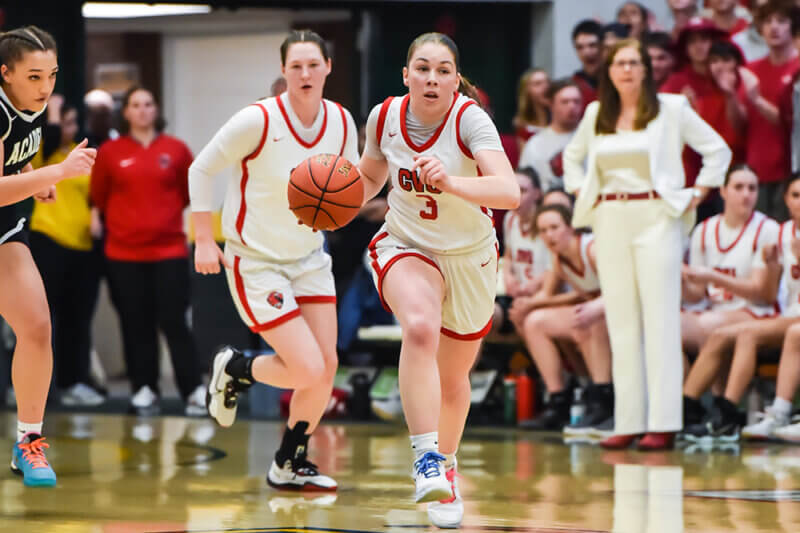 Photo by Al Frey
Merrill Jacobs drives down the court in CVU’s state title win over St. Johnsbury on March 6 at Patrick Gymnasium.