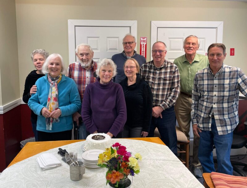 Photo by Lori York. Beloved board member, Beth Merritt is moving out of state. The Charlotte Senior Center board gathered for cake and to wish Beth well on her next adventure.