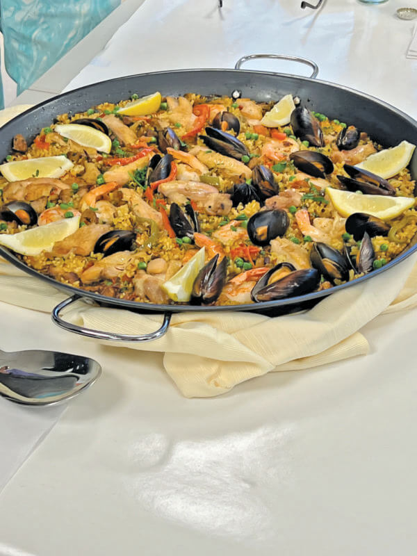 Photos by Anne Marie Andriola 
From left, Spanish paella was one dish from the library’s latest cooking book club event on April 10.