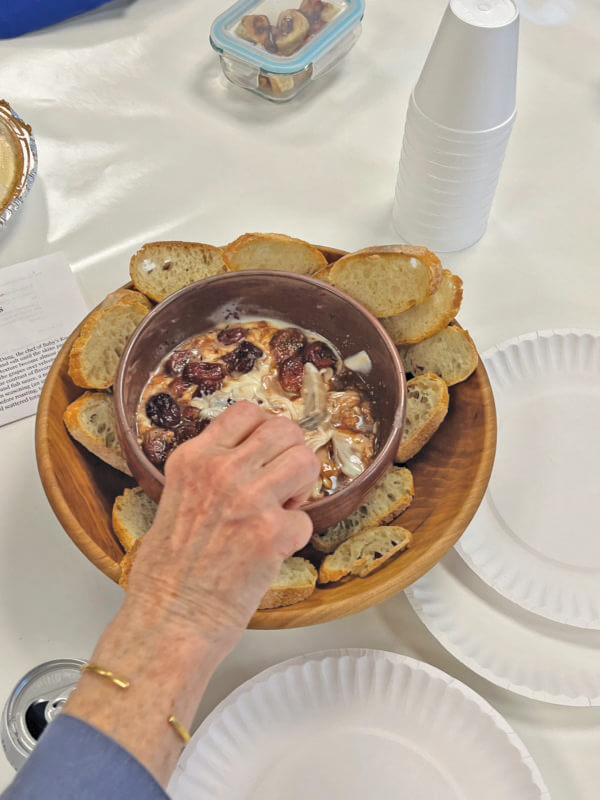 Photos by Anne Marie Andriola From left, roasted grapes with ricotta was one dish from the library’s latest cooking book club event on April 10.