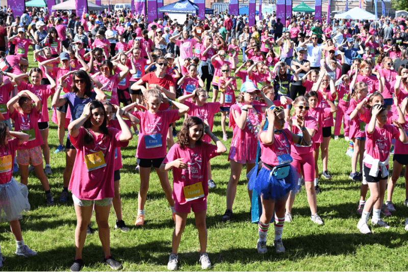 Photo by Lee Krohn.
Girls warm up in their pink attire for a 5K run in Essex in early June.