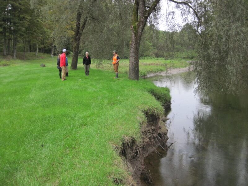 Photo by Jessica Louisos.
A Lewis Creek Association project team visits with landowners at a potential tree-planting site. 
