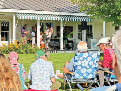 Photos by Scooter MacMillan. Almost 200 people turned out to the town green for bluegrass. Forest Station & Friends played their rousing and tasteful selections from the bluegrass canon at the summer’s last Grange on the Green concert on July 25.
