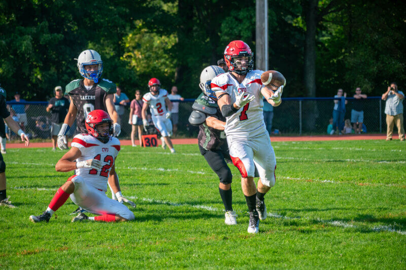 Photo by Calvin Morse. Tight end Dylan Terricciano completes a reception in Champlain Valley’s 40-6 win over Colchester. This Friday, Sept. 20, the Redhawks travel to BFA-St. Albans for a 7 p.m. game.