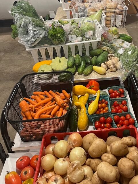 Photo by Nancy Bloch. 
A colorful summer harvest is spread out on a table at the Charlotte Food Shelf. If you have surplus from your harvest, please bring it to the food shelf’s 3-6 p.m., Wednesday, Sept. 25, distribution.