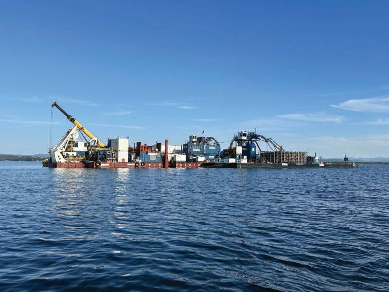 Photo by Nancy Wood Barges that were visible from Charlotte on Lake Champlain were laying cable to carry power from Quebec to New York City.