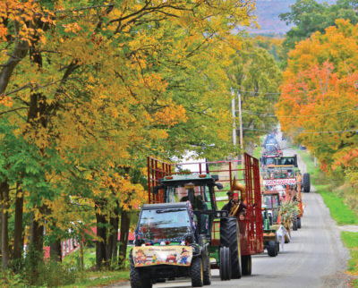 Photo by Janet Armell A view of the tractor parade as it makes its way up Prindle Road.