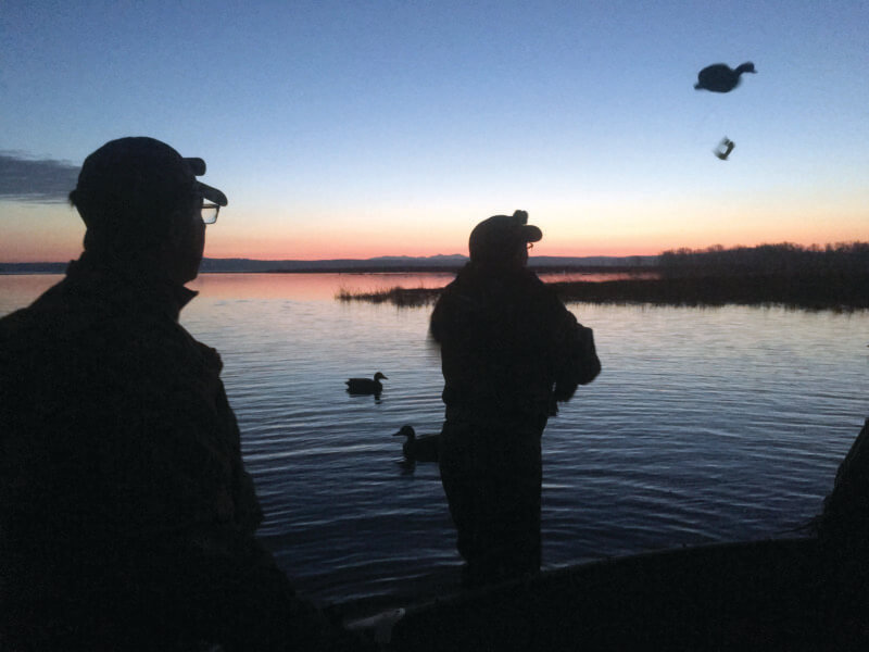 Photo by Bradley Carlton.
Tossing duck decoys at dawn.