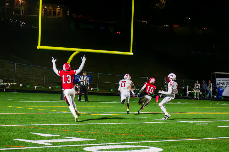 Photo by Calvin Morse
George Taylor celebrates as his teammate and Charlotte neighbor Dylan Frere scores in the state championship on Nov 9.