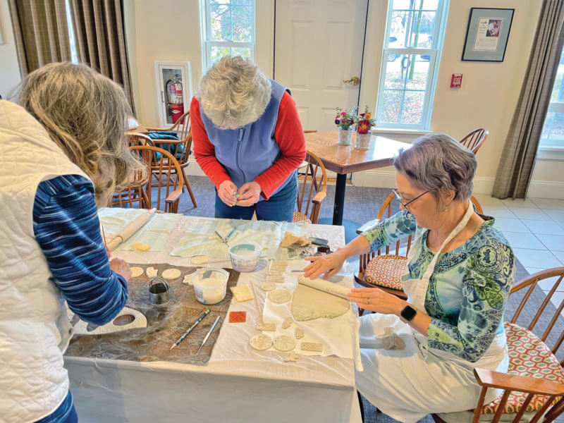 Seniors work on handcrafted porcelain ornaments.