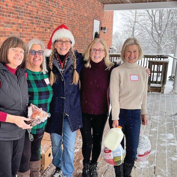 Photo courtesy of Margaret Sharpe.
Snowy, blustery weather did not slow down, from left, Peggy Sharpe, Maria Blanchette, Laura Iglehart, Nancy Bloch and Janet Landrigan in their early morning preparation for the holiday food shelf distribution on Dec. 21.
