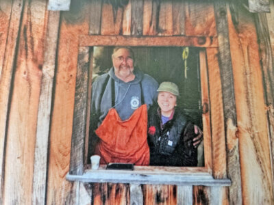 Photo by Matt Jennings. Pat and Aline LeClaire enjoy the view from inside and outside their sugarhouse.