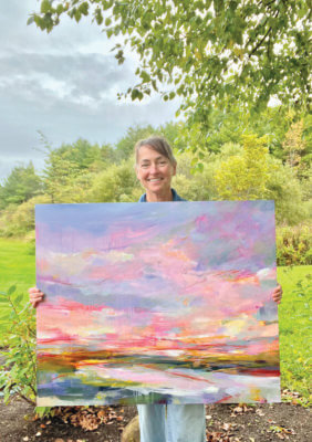 Photo by Kathleen Fleming. Kathleen Fleming with her painting Broadening the View.