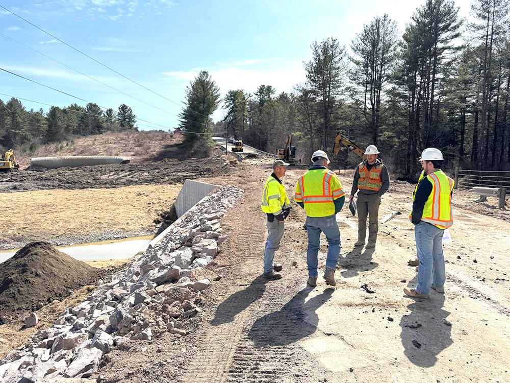Spear on target Photo by Dave Speidel. Far left, road commissioner Junior Lewis talks with workers on the Spear Street bridge. The repairs look to be on target for meeting the April 6 deadline in order to qualify for federal funds to pay for the reconstruction. Lewis said there were still a few things to do before the road will reopen like putting up guard rails. Spear Street will be unpaved here when it reopens because paving companies aren’t paving this early in the year. Lewis said it should be paved in May.