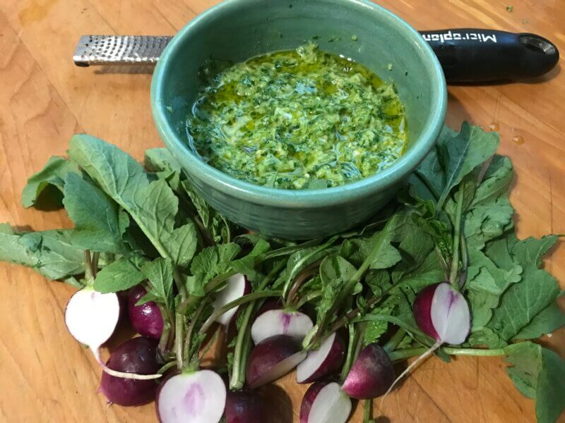 With a food processor, everything gets tossed in to make this pesto: a little garlic, radishes and their greens, some lemon and a drizzle of healthful fruity olive oil.