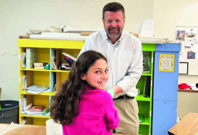 Photo contributed. Maddie Kolb holds a brain with Dr. Scott Lollis.
