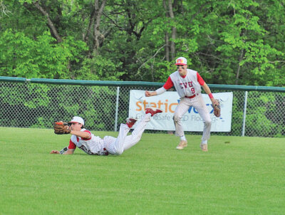 Photos by Judy Stroh. Noah Musgrave makes a diving catch against Colchester on Thursday, May 29, as Andrew Nunziata looks on.