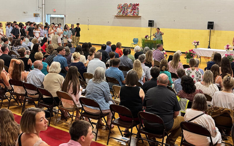 The Charlotte Central School gymnasium fills up with the graduates’ families and friends.