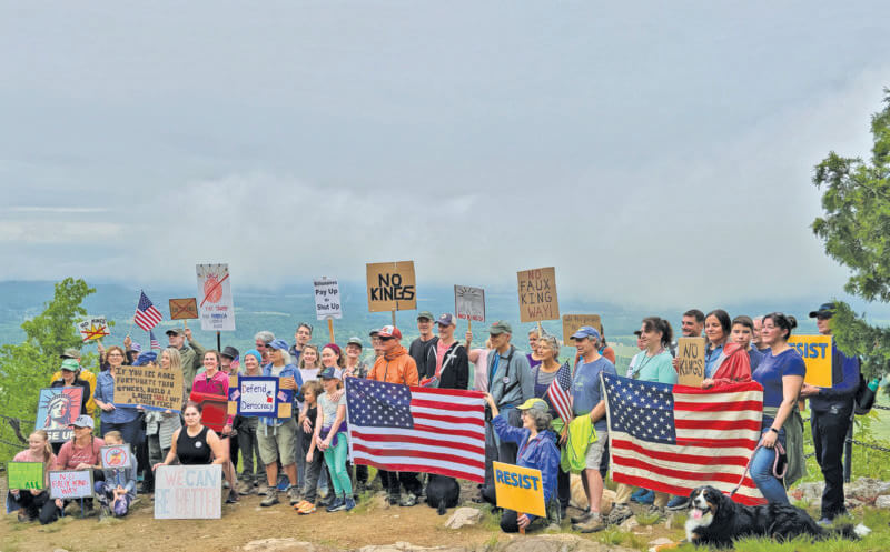 Almost 50 people marched up Mount Philo to protest.