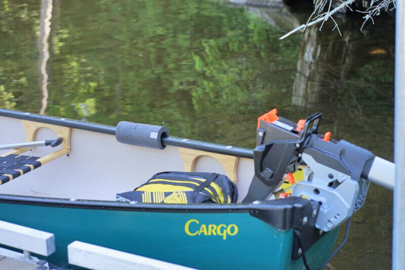 The electric Torqeedo motor attached to the boat without the battery. 