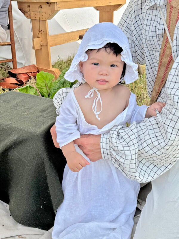 Photos by Scooter MacMillan. 
Yugin Roh at 10 months was the youngest reenactor, dressed in her historically accurate clothes.