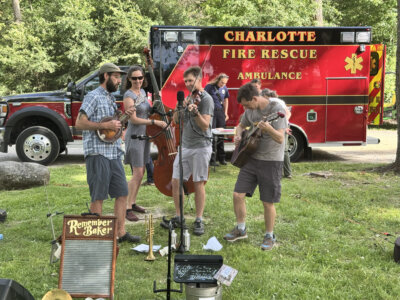 A Charlotte Volunteer Fire and Rescue vehicle made a nice backdrop for the Remember Baker band’s performance.