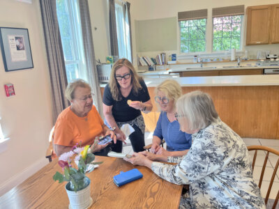 Photo by Lori York. Participants come together on Friday mornings at the center to enjoy coffee, homemade muffins and conversation.